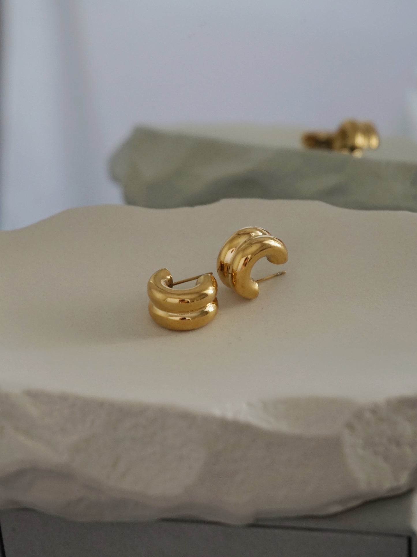 Gold chunky small hoops for everyday style. Third Tone jewelry.