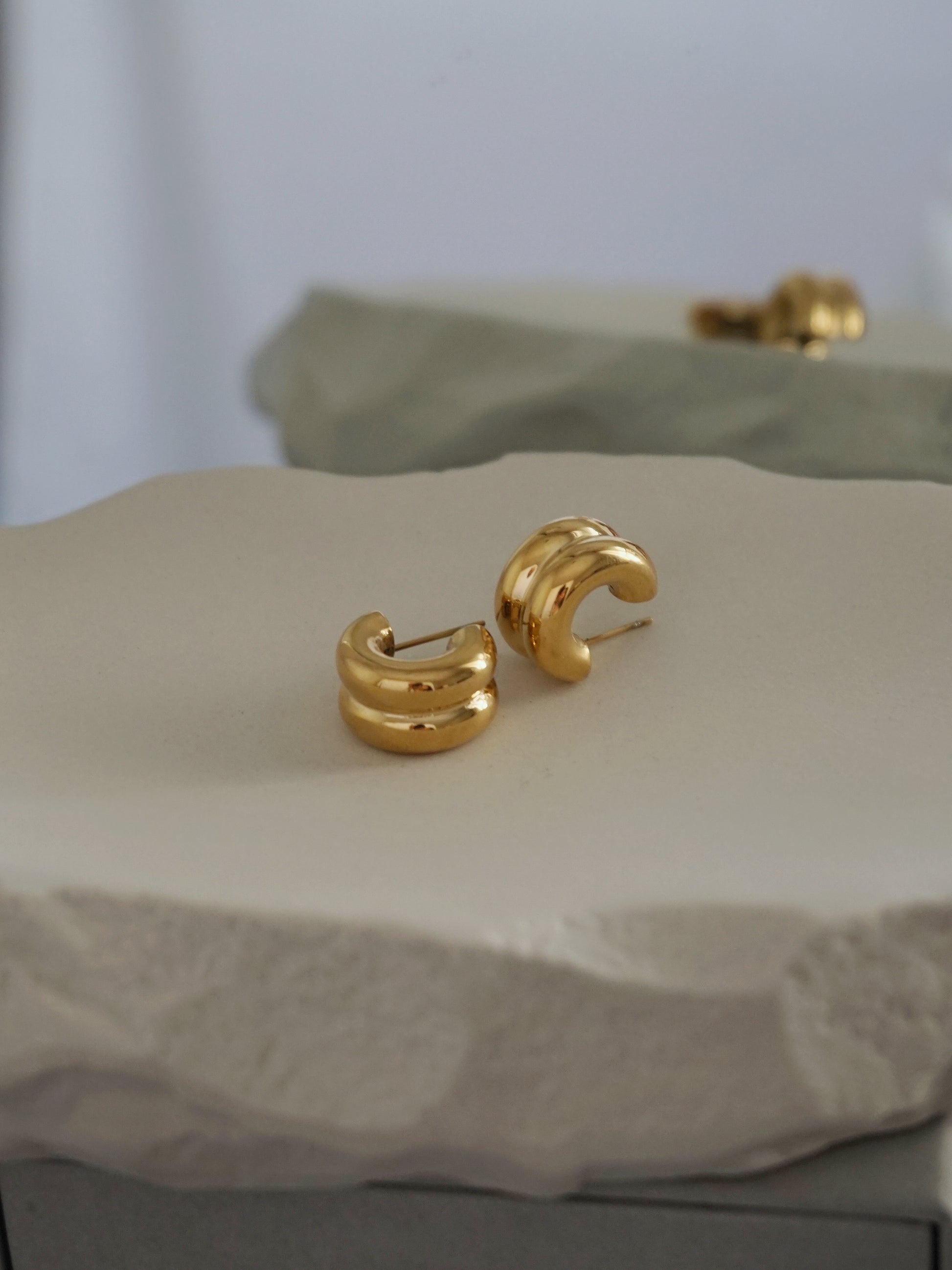 Gold chunky small hoops for everyday style. Third Tone jewelry.