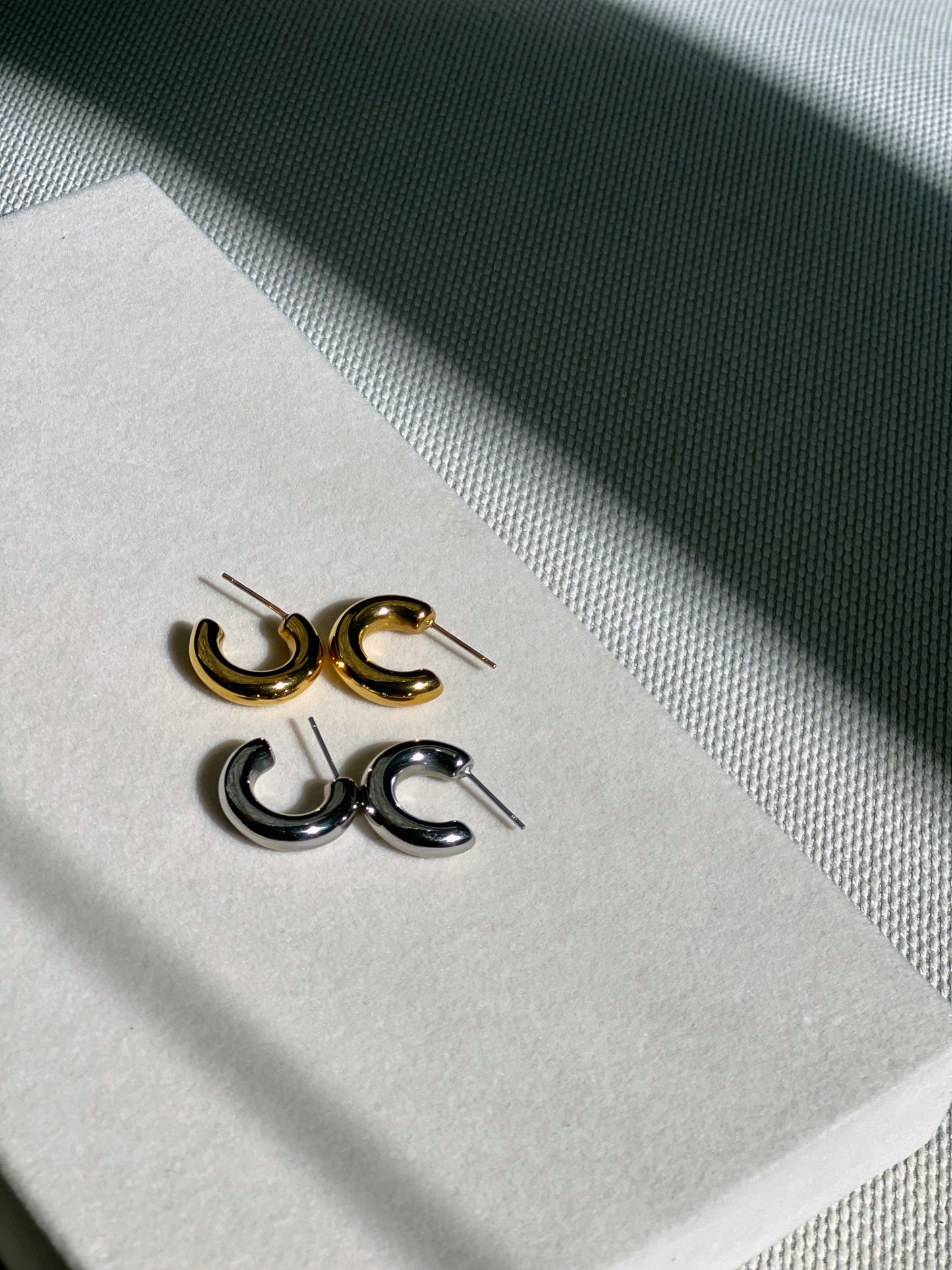 Minimal earrings for women. Small chunky hoops for women. Third Tone earrings. Aesthetic brands to shop.