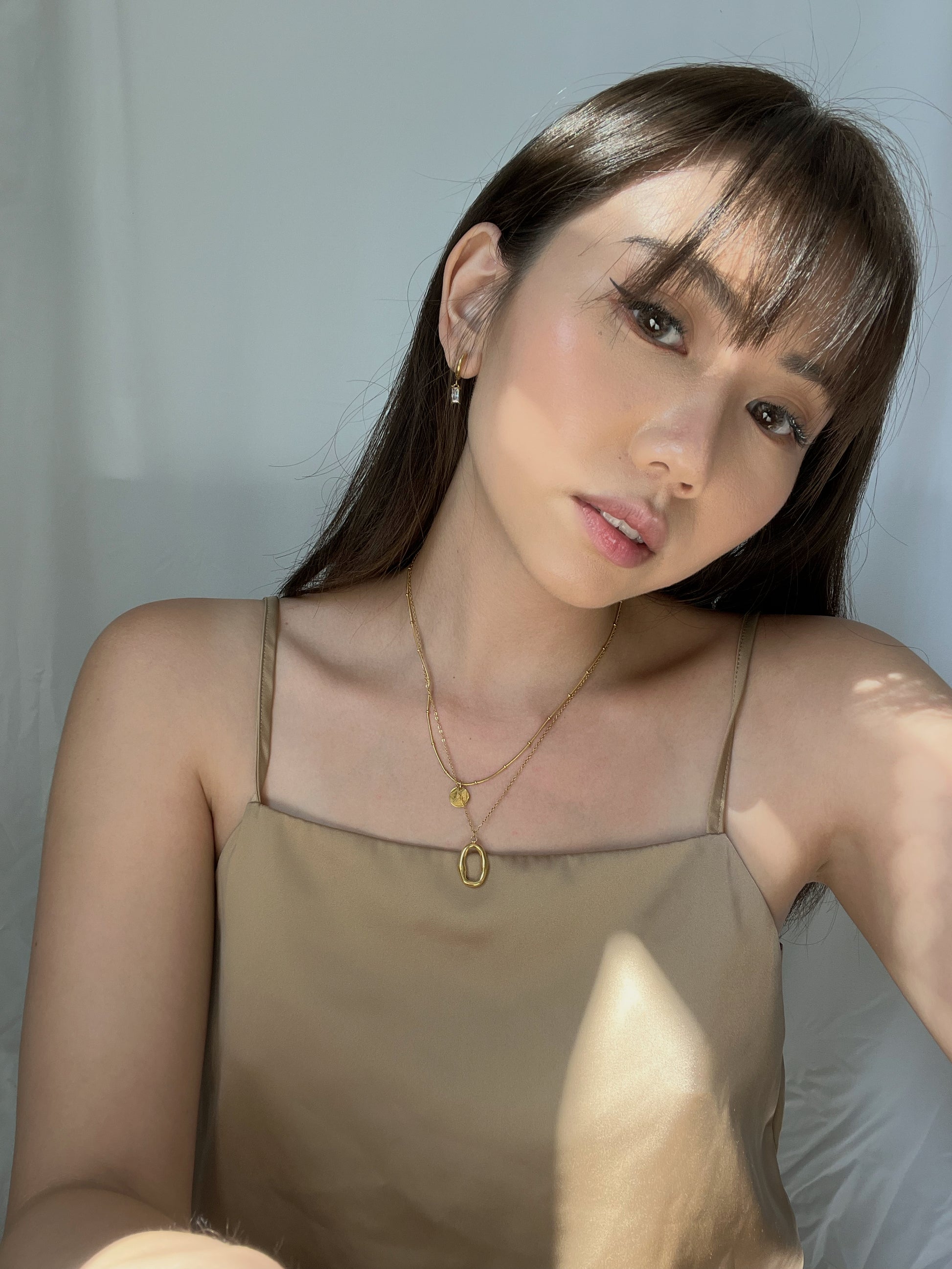 hoop earrings for women, third tone jewelry. minimal jewelry brand - third tone. jewelry aesthetic. affordable jewelry for women.