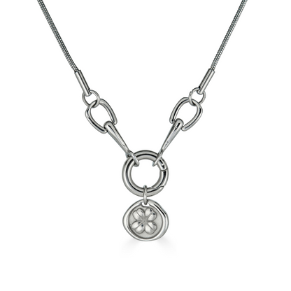 A silver necklace with a delicate four-leaf clover pendant attached to a horseshoe link, displayed on a white background.