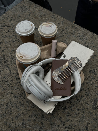 Third Tone mocha comb shown in lifestyle shot, with a tray of coffee and headphones