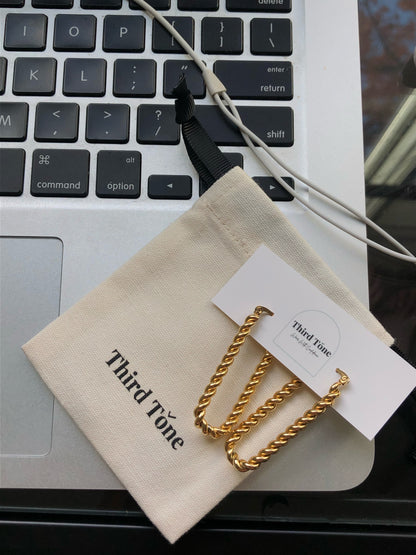 Gold Elegant Earrings. Night out accessory. The perfect date night outfit inspo. Third Tone Jewelry. Minimal fashion brand.
