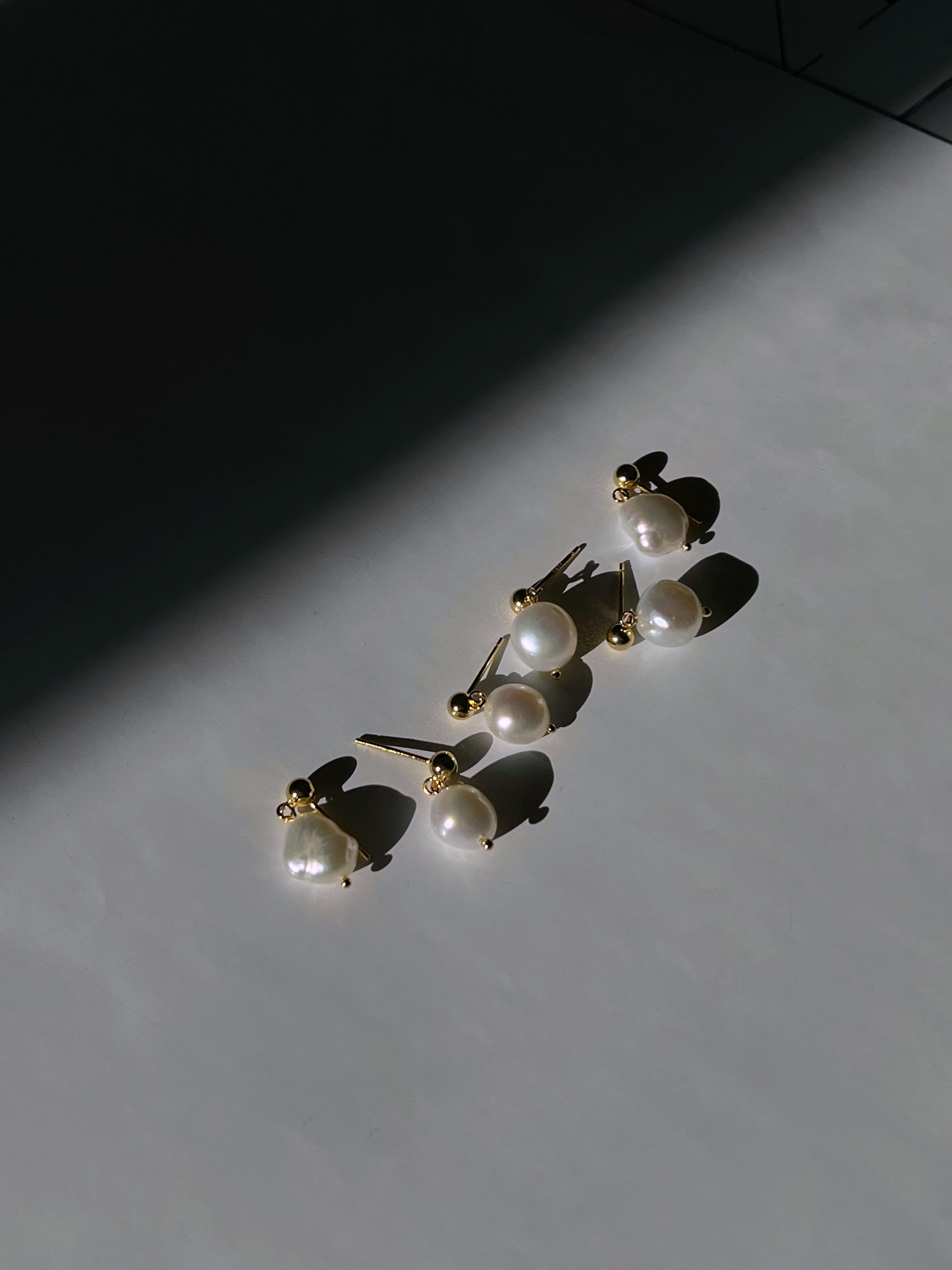 pearl earrings. elegant pearl earrings from third tone.
