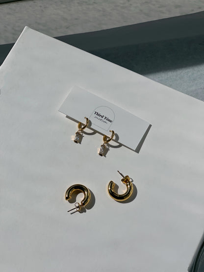 hoop earrings for women, third tone jewelry. minimal jewelry brand - third tone. jewelry aesthetic. affordable jewelry for women.